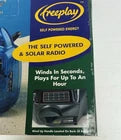 Radio AM/FM con cuerda y energía solar Freeplay, transparente azul, NUEVA